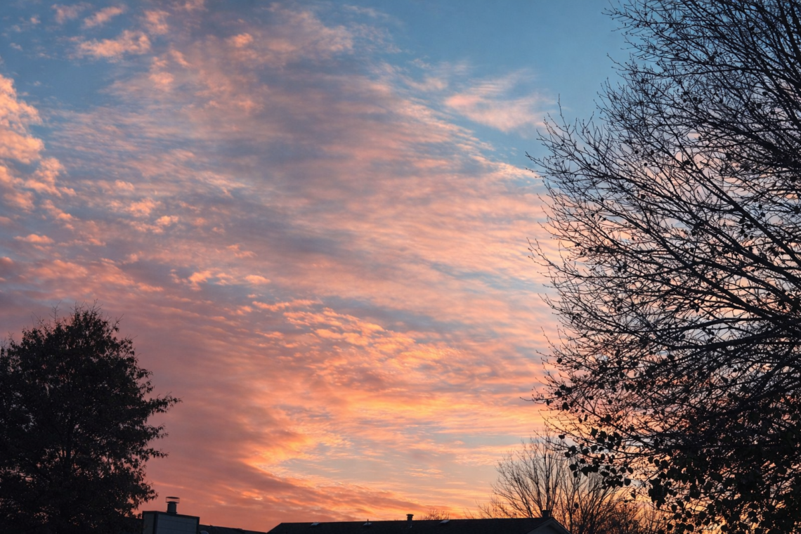 Soft morning light in the sky representing the natural transition at the end of life