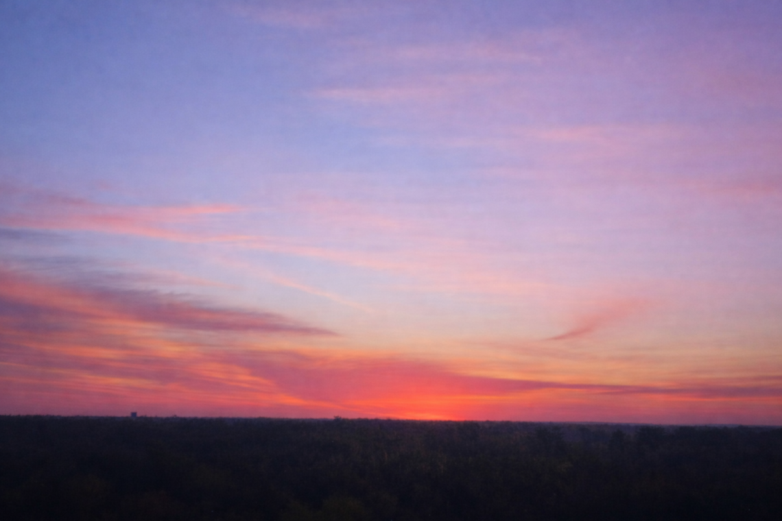 Sunrise viewed through a hospital window in Wichita during a family medical crisis